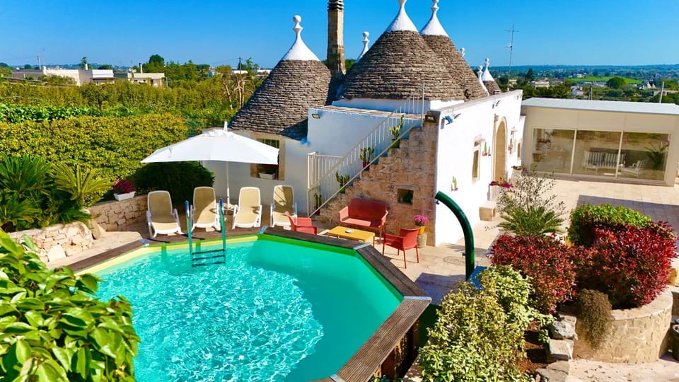 Property building, Patio, Natural landscape, Pool view, sunbed
