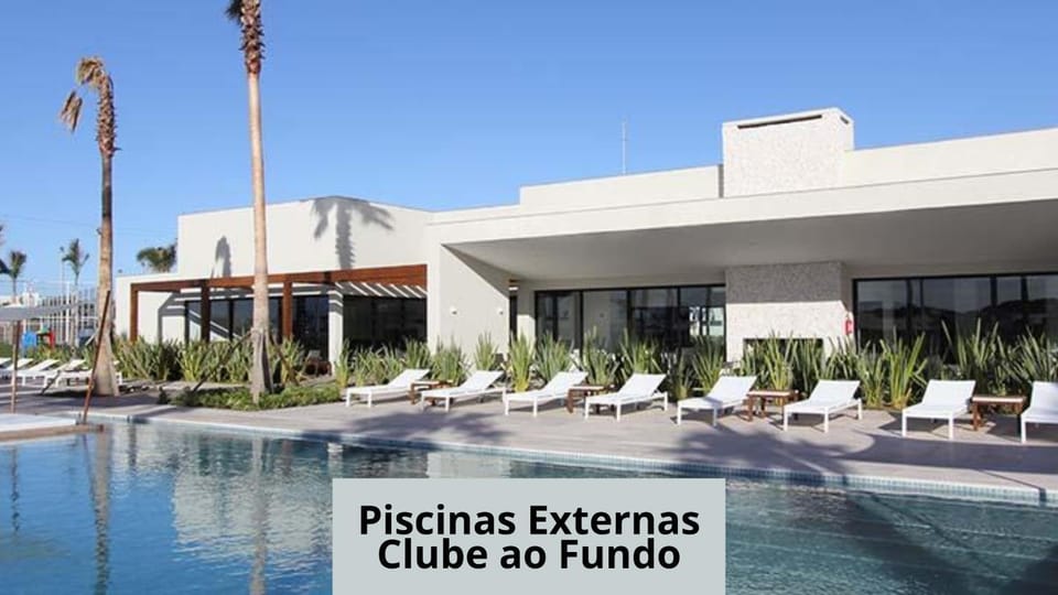 Property building, Day, Lounge or bar, Text overlay, Pool view, Swimming pool, Swimming pool, sunbed