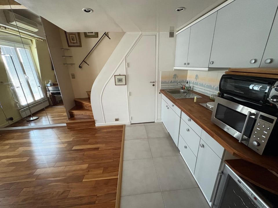 Kitchen or kitchenette, dishwasher, oven, stove, toaster