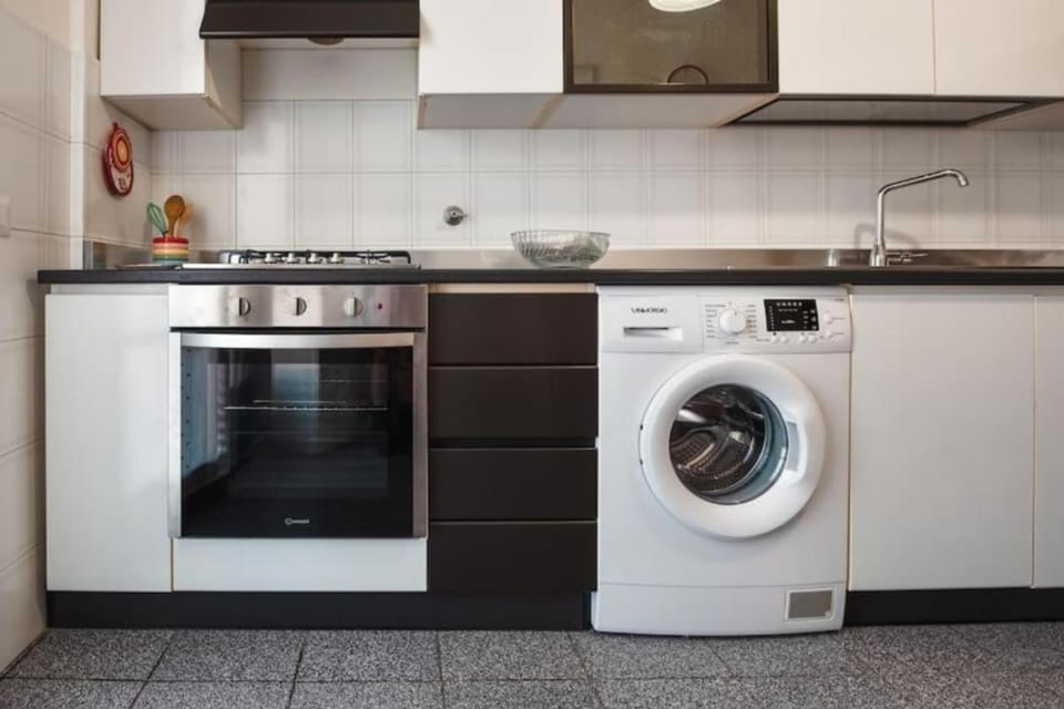 Kitchen or kitchenette, stove, washing machine