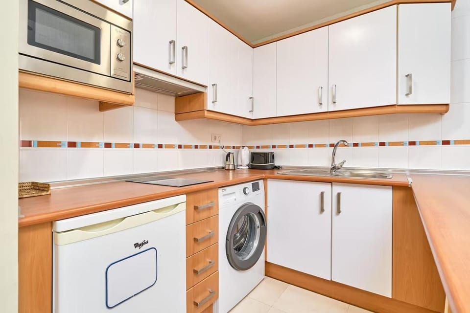 Kitchen or kitchenette, stove, washing machine