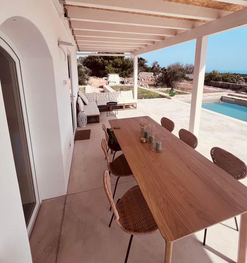 Patio, Day, Natural landscape, View (from property/room), Balcony/Terrace, Living room, Seating area, Dining area, Pool view, Sea view, Swimming pool, sunbed