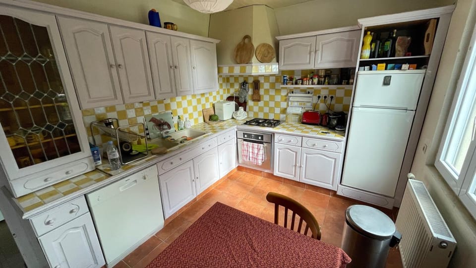Kitchen or kitchenette, dishwasher, oven, stove