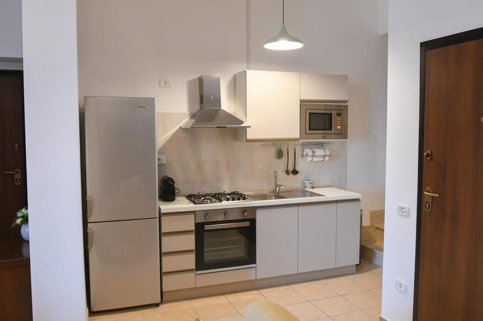 Kitchen or kitchenette, dishwasher, oven, stove, toaster