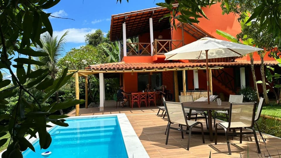 Property building, Patio, Dining area, Pool view, sunbed