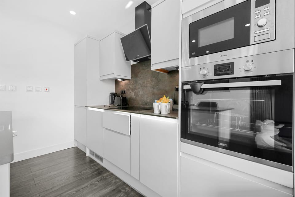Kitchen or kitchenette, dishwasher, oven, stove, toaster