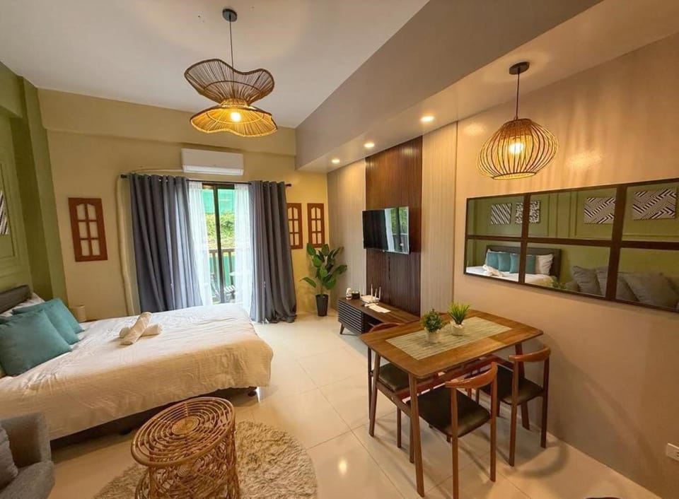 Bed, TV and multimedia, Living room, Seating area, Bedroom