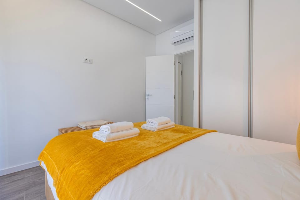 Bed, Photo of the whole room, Bedroom, towels, air conditioner
