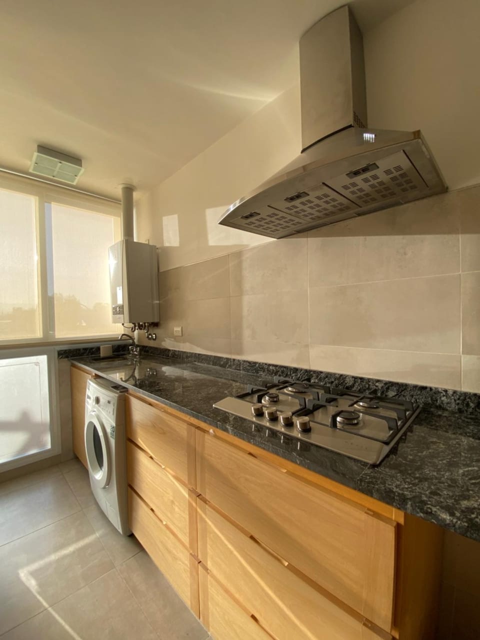 Kitchen or kitchenette, stove, washing machine