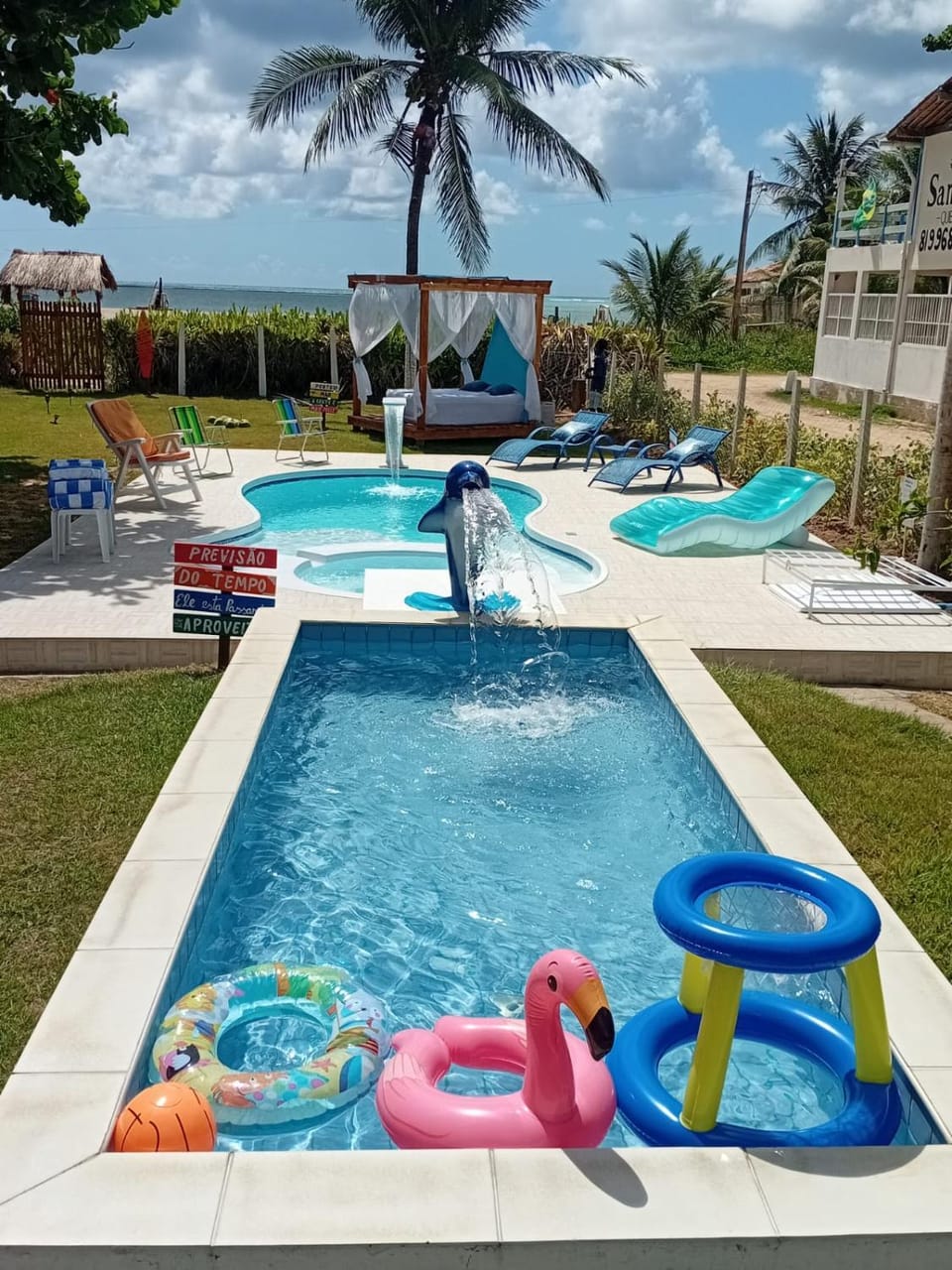 Swimming pool, sunbed, towels