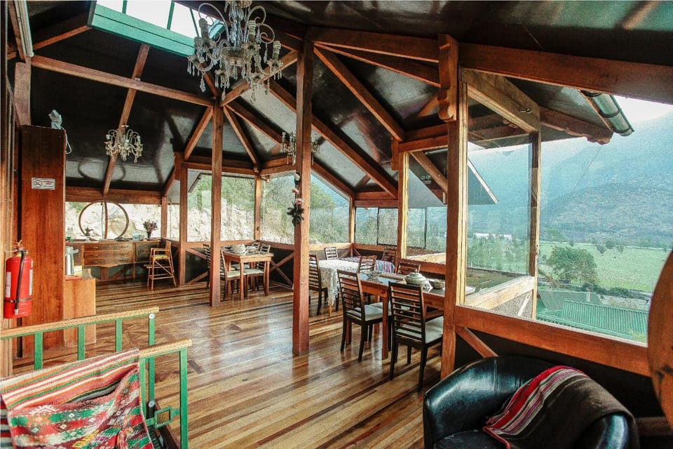 Natural landscape, View (from property/room), Living room, Lounge or bar, Seating area, Dining area, Food, Mountain view