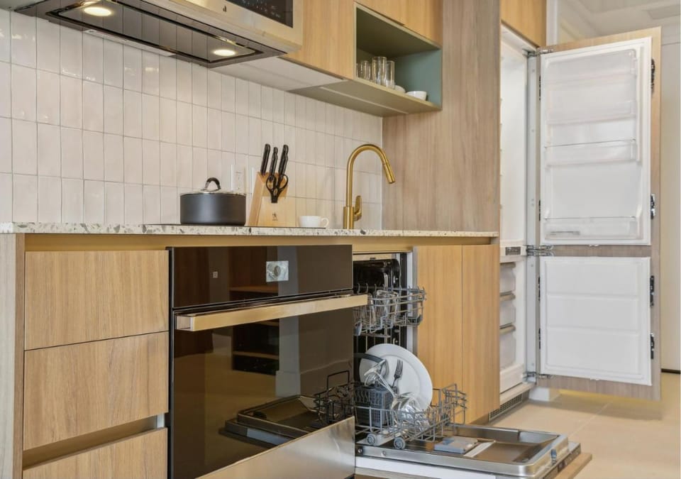 Kitchen or kitchenette, dishwasher, oven, stove