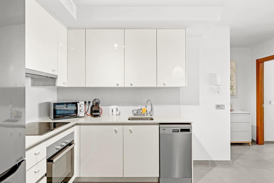 Kitchen or kitchenette, dishwasher, oven, stove, toaster