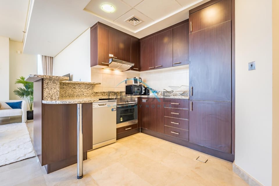 Kitchen or kitchenette, dishwasher, oven, stove, toaster