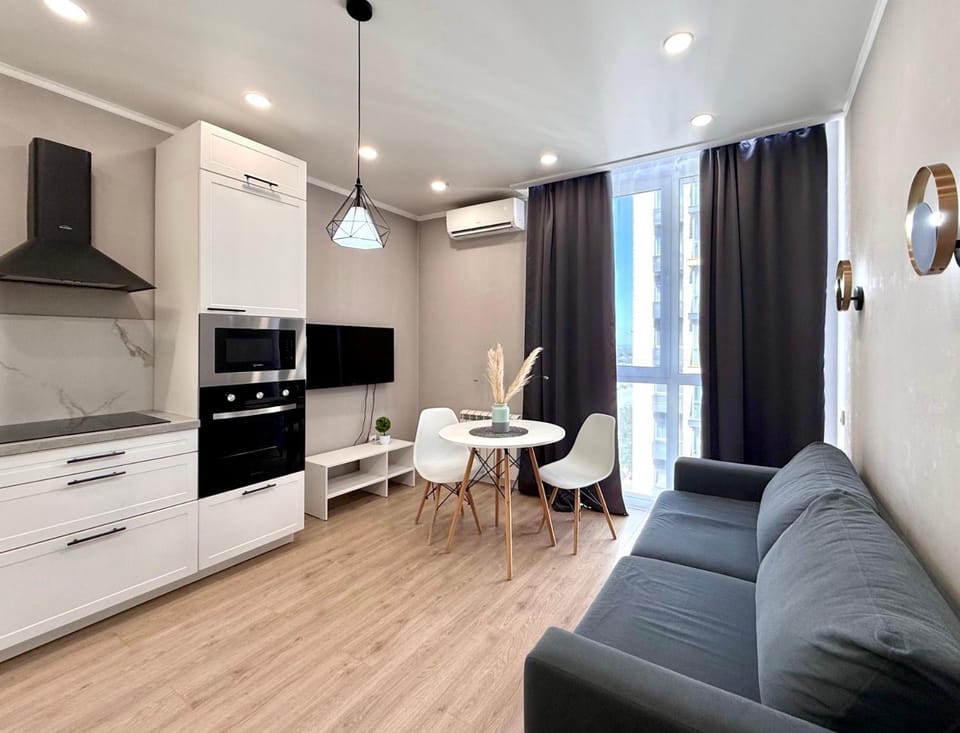 Kitchen or kitchenette, Living room, Seating area, Dining area, stove, air conditioner