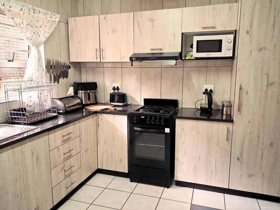 Kitchen or kitchenette, microwave, stove, toaster, kitchen