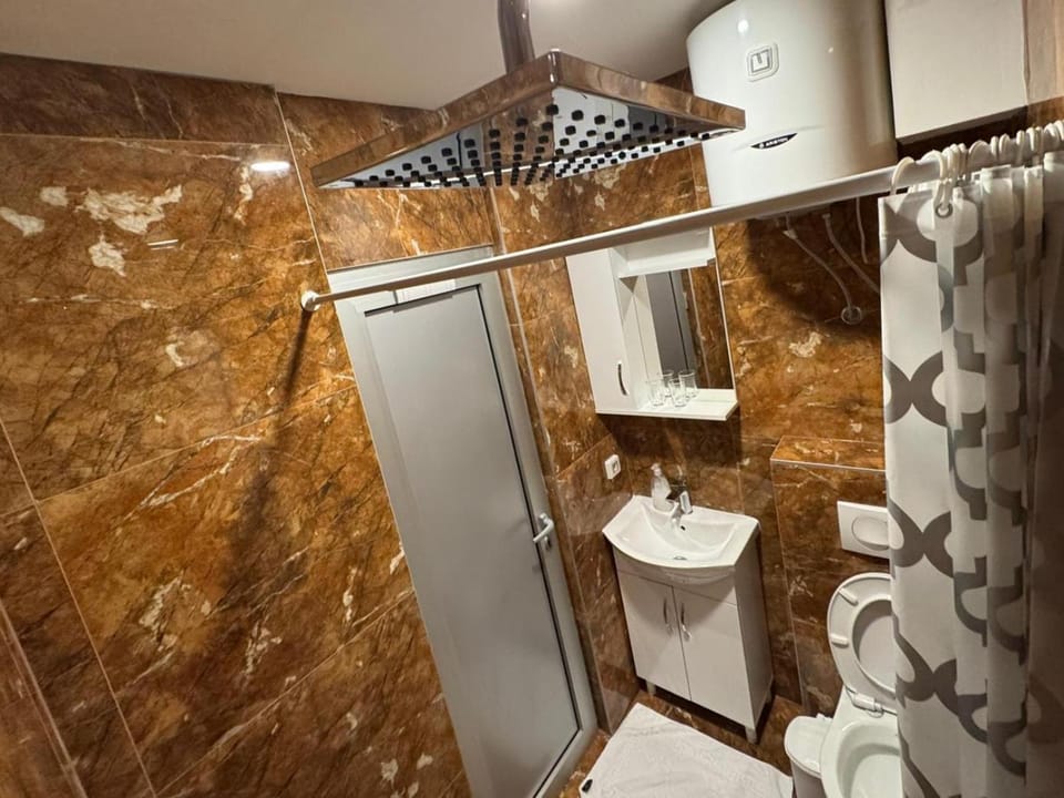 Shower, Toilet, Bathroom, hair dryier, towels