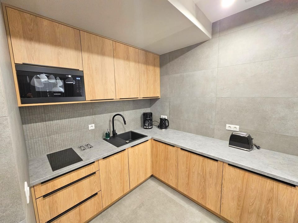 Kitchen or kitchenette, dishwasher, microwave, oven, washing machine, kitchen