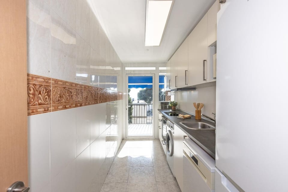 Kitchen or kitchenette, washing machine
