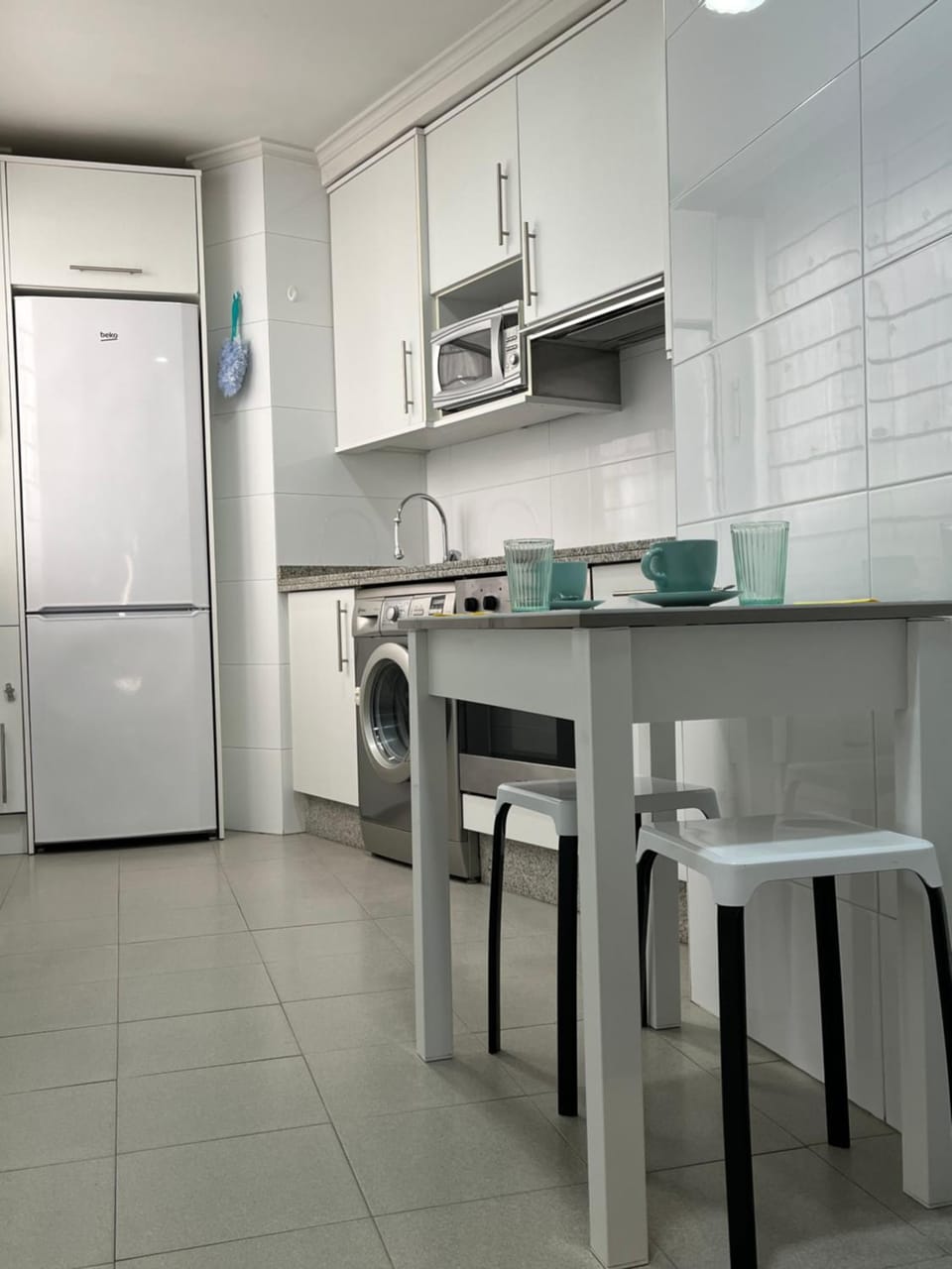 Kitchen or kitchenette, oven, stove, washing machine