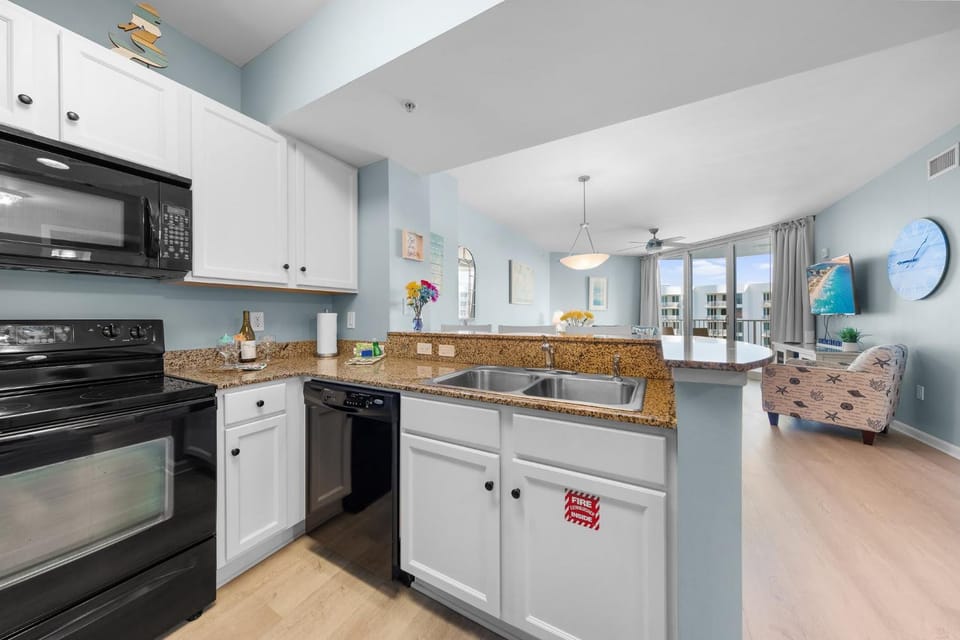 Kitchen or kitchenette, dishwasher, oven, stove, toaster