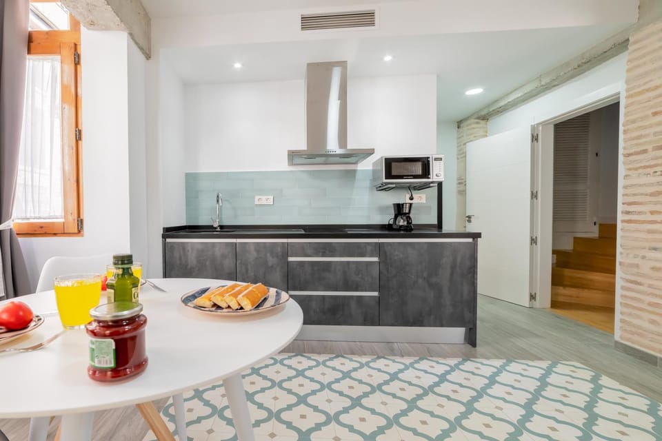 Kitchen or kitchenette, microwave, stove, toaster