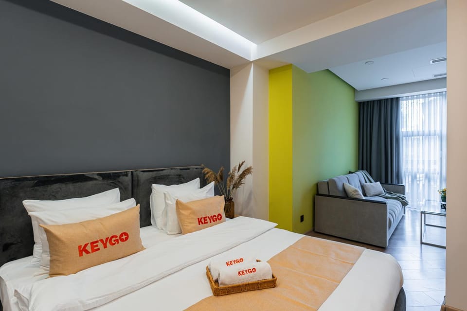 Bed, Living room, Seating area, Bedroom