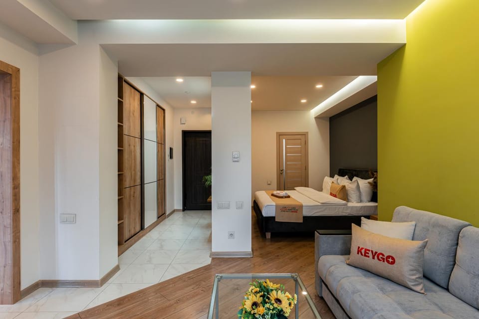 Bed, TV and multimedia, Living room, Seating area, Bedroom, wardrobe