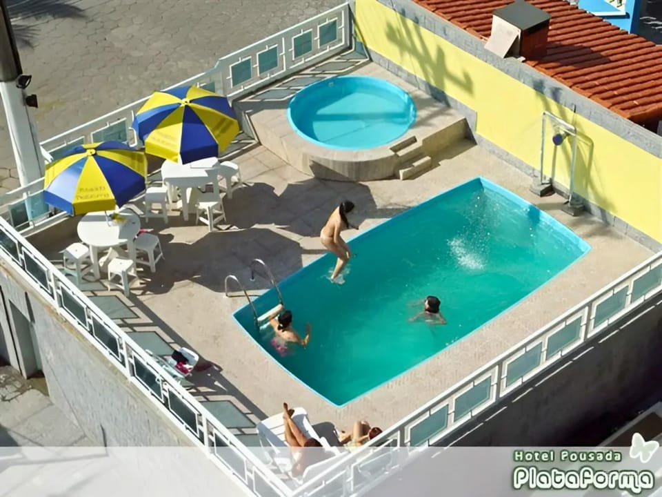 People, Natural landscape, Pool view, Swimming pool, Swimming pool, group of guests, sunbed