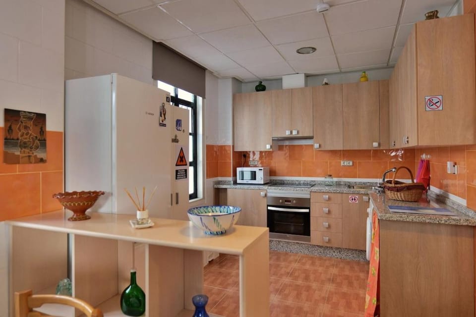 Kitchen or kitchenette, microwave, oven, stove, washing machine
