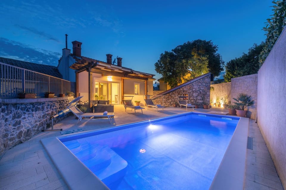 Property building, Patio, Night, Swimming pool, sunbed