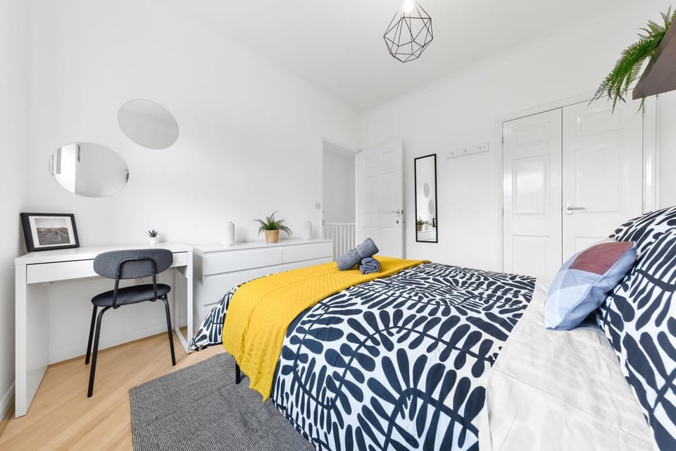 Bed, Photo of the whole room, Bedroom, flat iron, hair dryier, towels, wardrobe