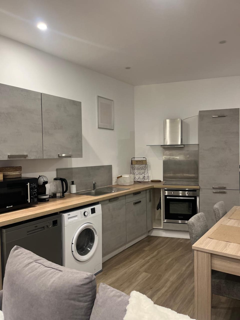 Kitchen or kitchenette, dishwasher, oven, stove, washing machine