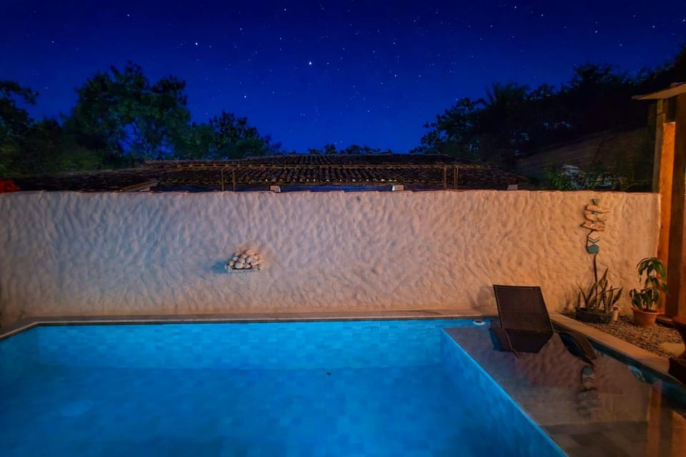 Patio, Night, Pool view, Swimming pool, sunbed