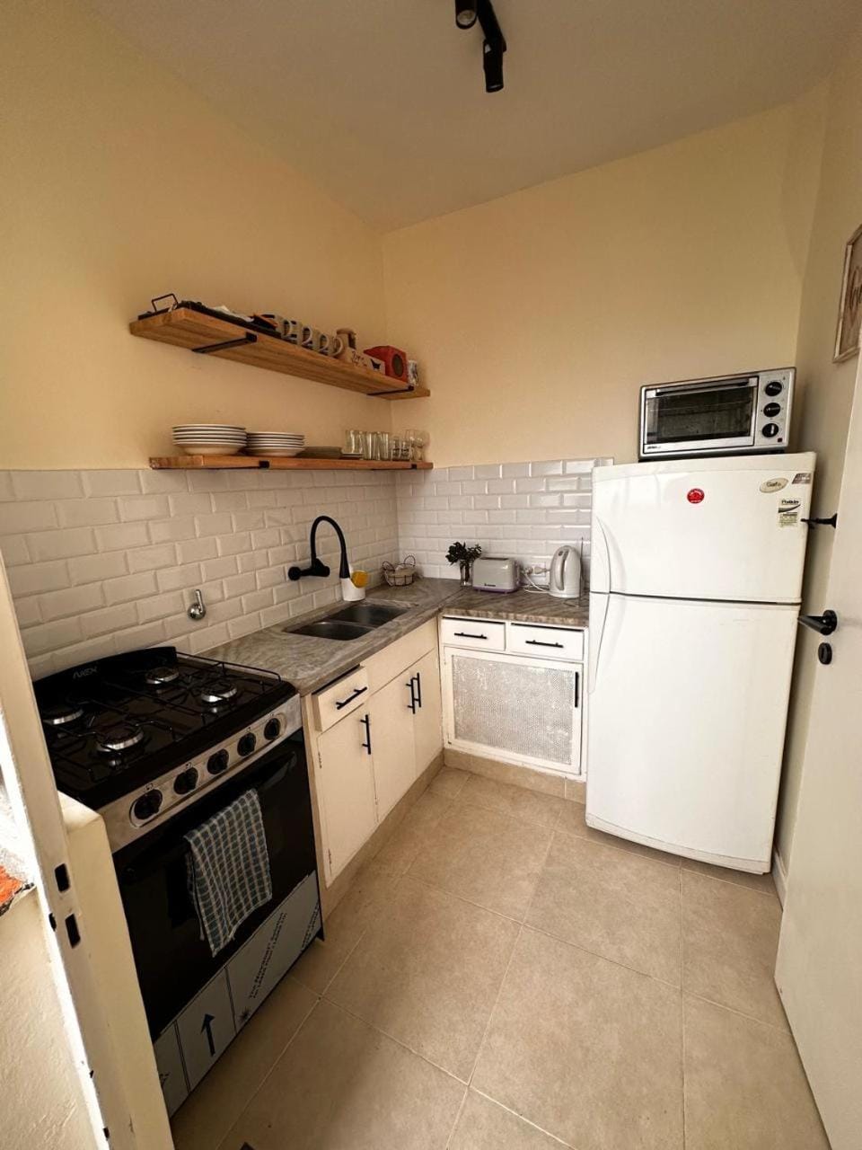 Kitchen or kitchenette, oven, stove, toaster
