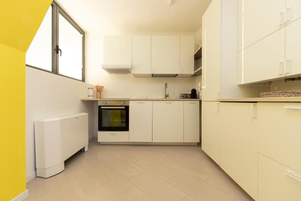 Kitchen or kitchenette, dishwasher, oven, stove