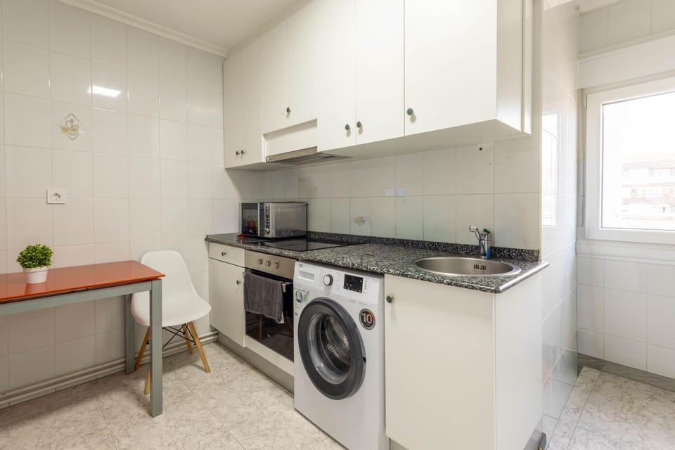 Kitchen or kitchenette, stove, washing machine