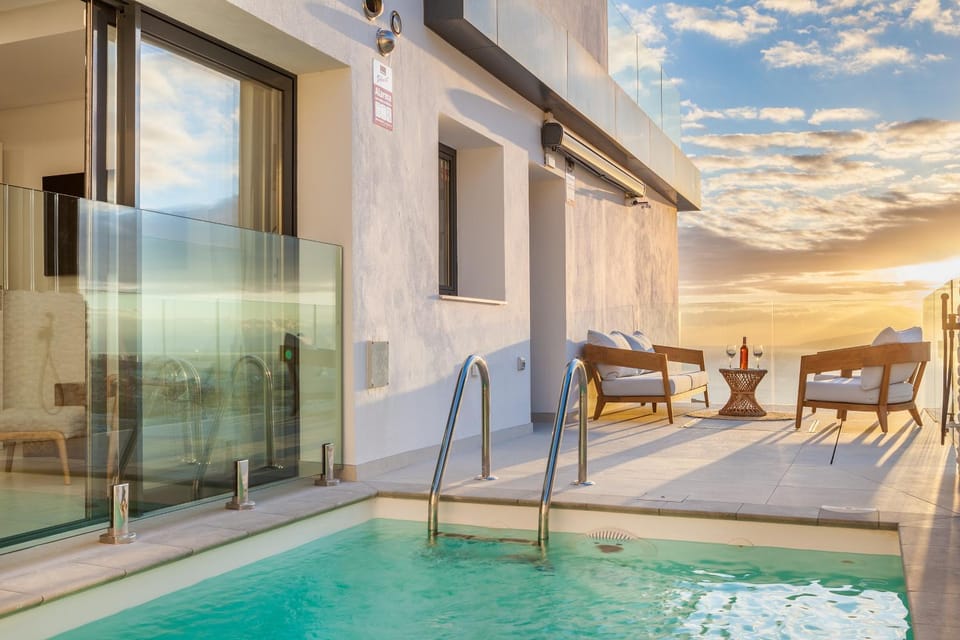 View (from property/room), Balcony/Terrace, Balcony/Terrace, Seating area, Pool view, Sunrise, Sunset