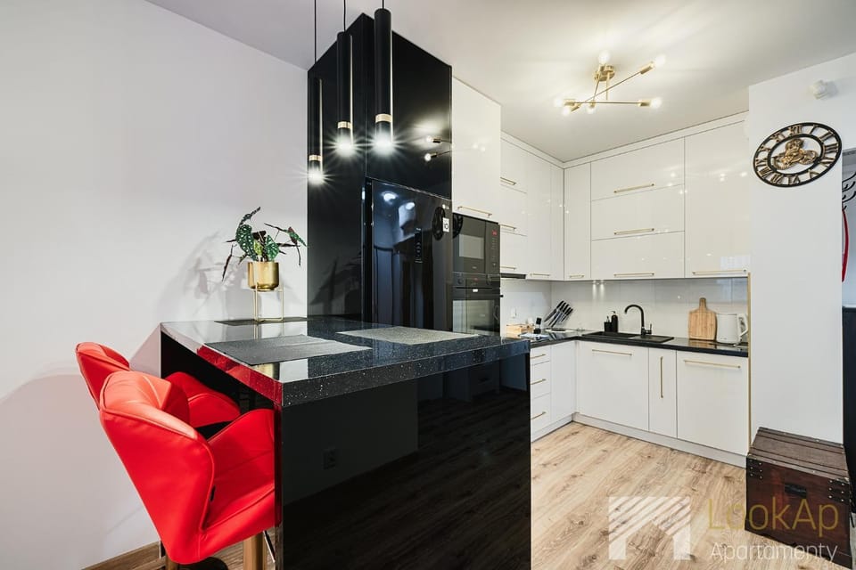Kitchen or kitchenette, dishwasher, oven, stove