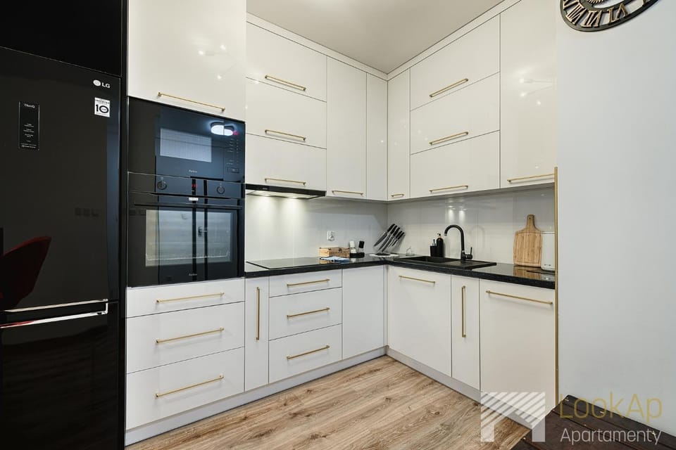 Kitchen or kitchenette, dishwasher, oven, stove