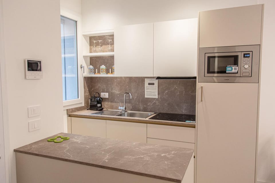 Kitchen or kitchenette, dishwasher, microwave, oven