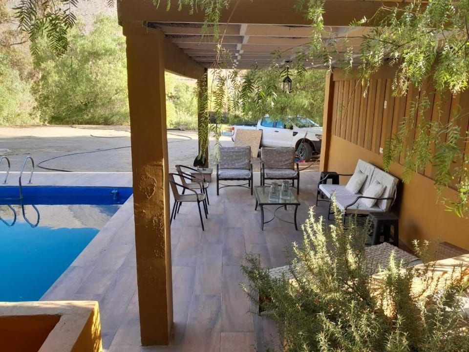 Off site, Living room, Seating area, Swimming pool
