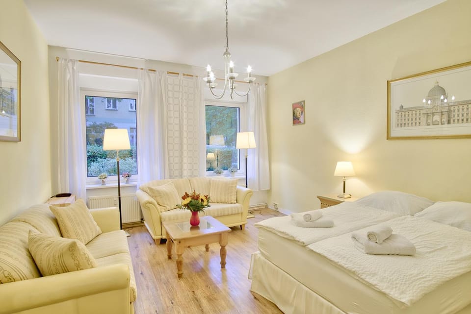 Bed, Living room, Seating area, Bedroom