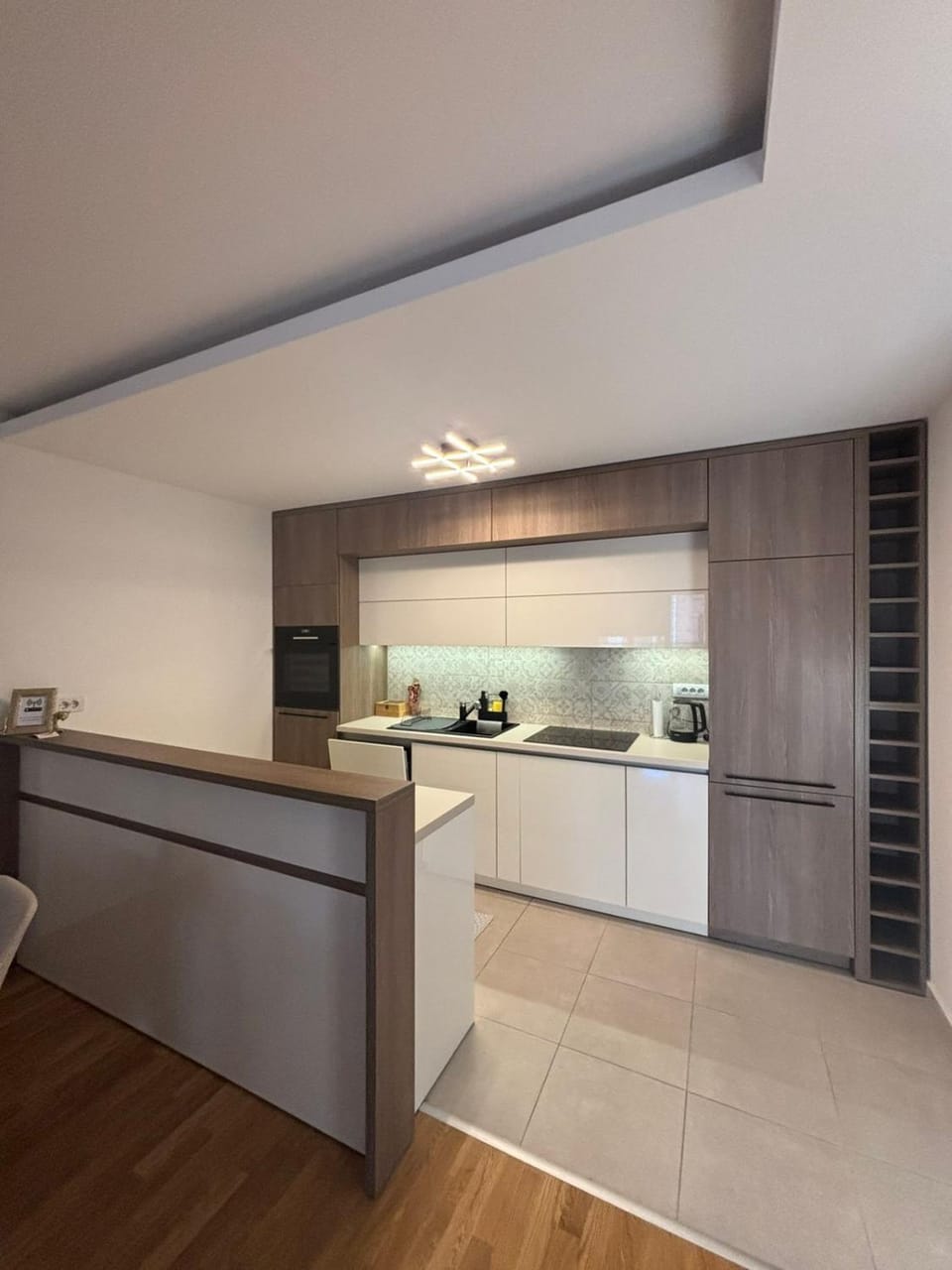 Kitchen or kitchenette, dishwasher, oven, stove