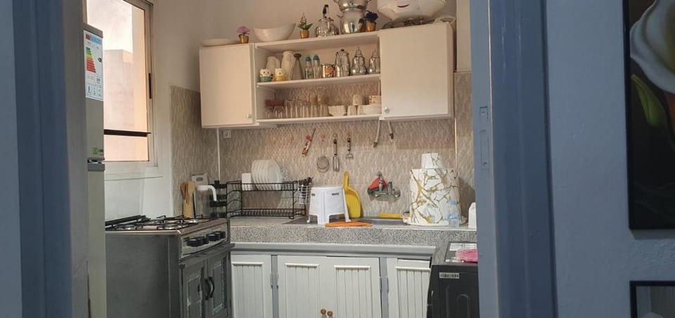 Kitchen or kitchenette, dishwasher, oven, stove
