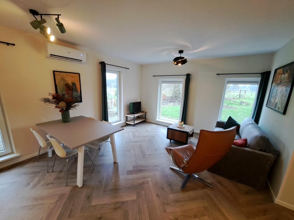 TV and multimedia, View (from property/room), Living room, Seating area, Dining area, air conditioner