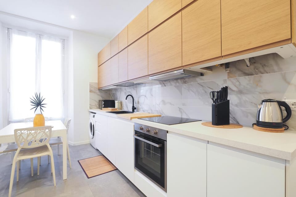 Kitchen or kitchenette, dishwasher, oven, stove