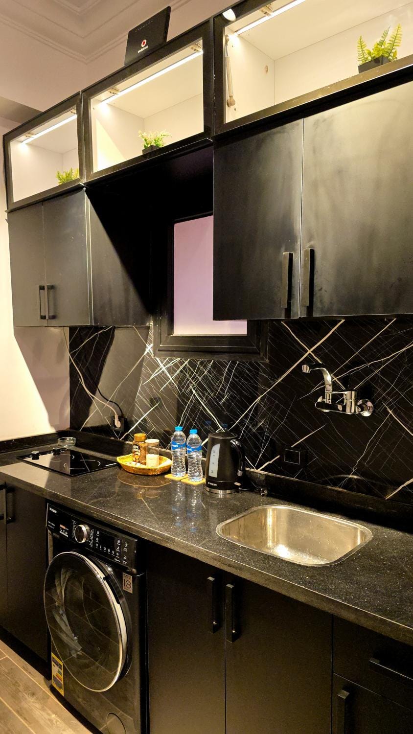 Kitchen or kitchenette, washing machine