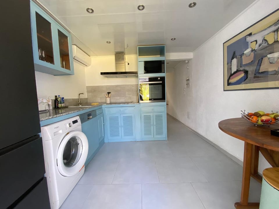 Kitchen or kitchenette, dishwasher, oven, stove, washing machine