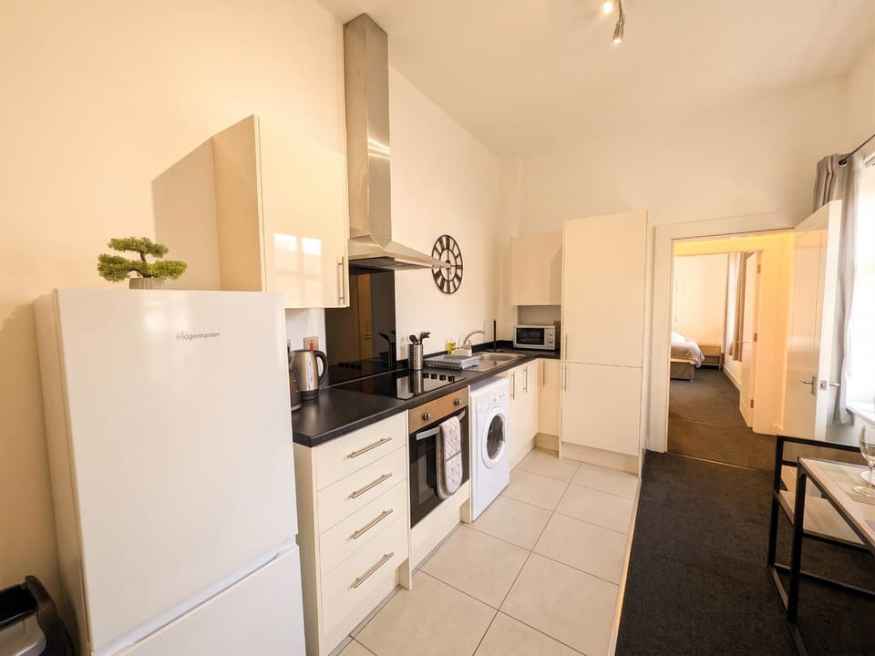 Kitchen or kitchenette, oven, stove, toaster